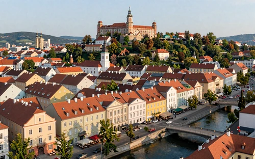 Ljubljana Slovenia city center with castle on hilltop and riverside cafes